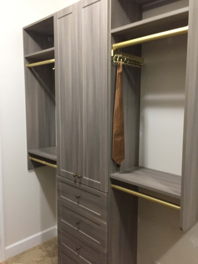 Grey Closet with Brushed Brass Rods